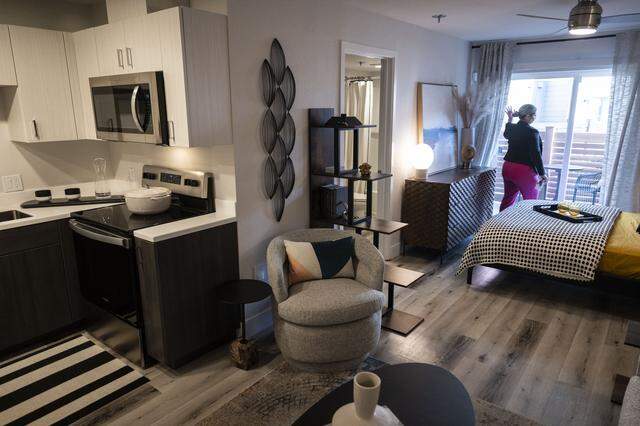 An employee gives a tour of the Track 281 housing complex, a former hotel in Sacramento’s River District, in January.